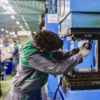 Production Line Workers Manufacturing workers working in an industrial hardware factory.