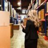 Rear view of businesswoman in warehouse Rear view of businesswoman in warehousehttp://www.twodozendesign.info/i/1.png
